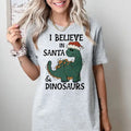 I believe in Santa and Dinosaurs - T-Shirt -  Print is Sublimation, Unisex T-Shirt, Funny Tee,Gift Idea, Womenswear Graphic Top Cute