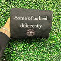 Some of us heal differently embroidered sweater