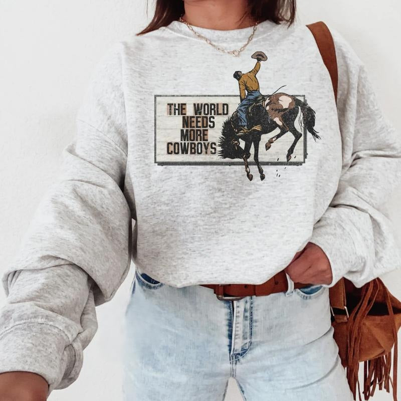 The World Needs More Cowboys Sweatshirt, western clothing, western outfits women, western tops, T-shirt and Hoodie