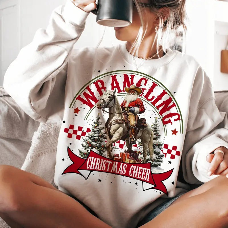 Wrangling Western Christmas Cheer Unisex Crewneck SweatShirt, Christmas Santa Claus Riding Horse, Cowboy, Cowgirl Christmas Tee